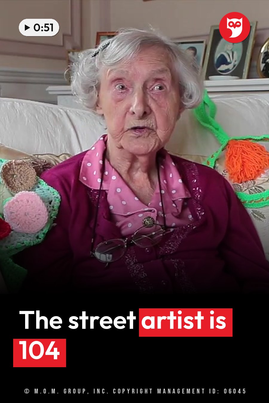 Grace Brett, an elderly woman with white hair and glasses, sits on a couch in a pink polka-dot shirt. A headline runs in white letters across the lower third.