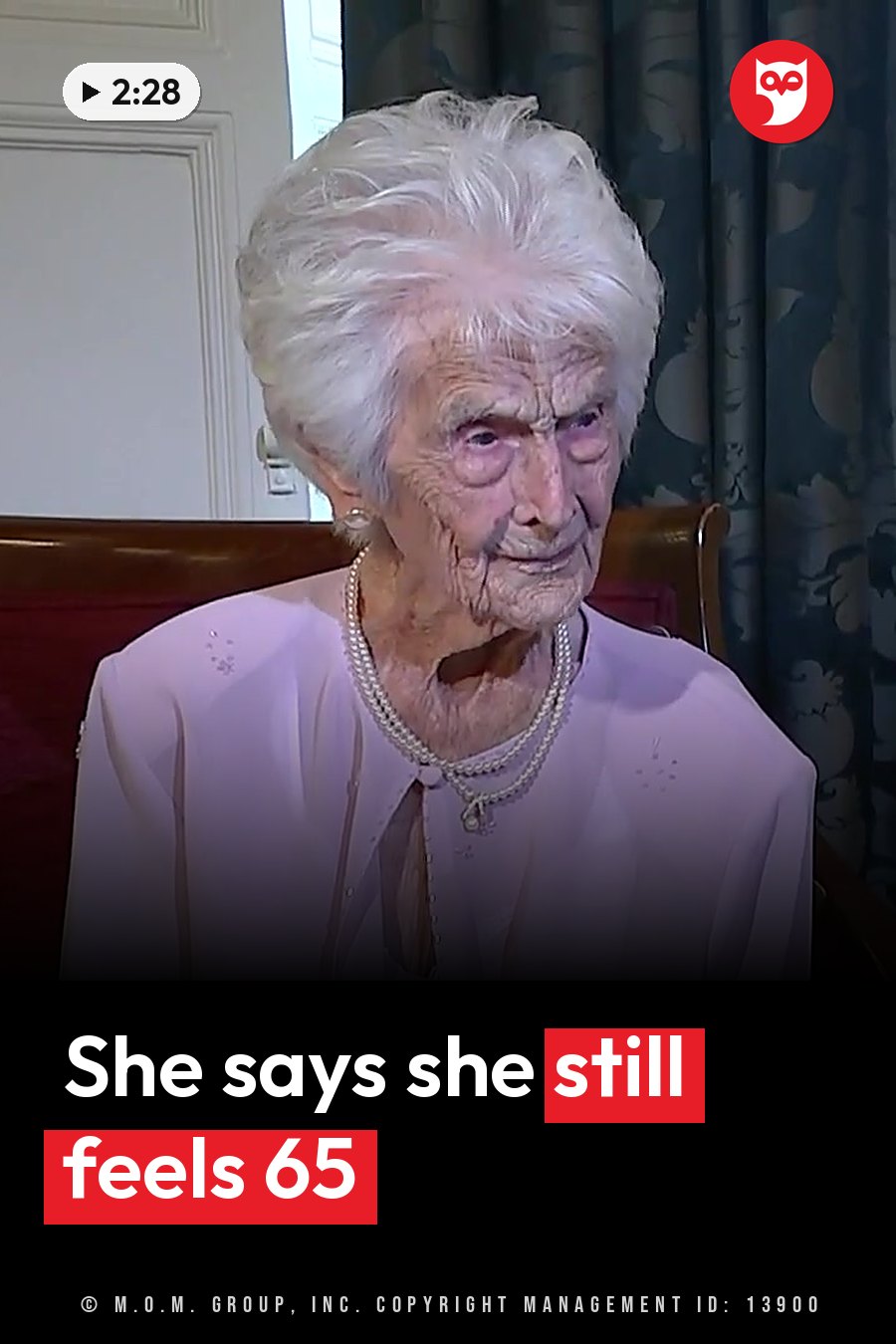 Grace Jones, an elderly woman with white hair, sits wearing a light pink blouse and a pearl necklace. A headline runs in white letters across the lower third.