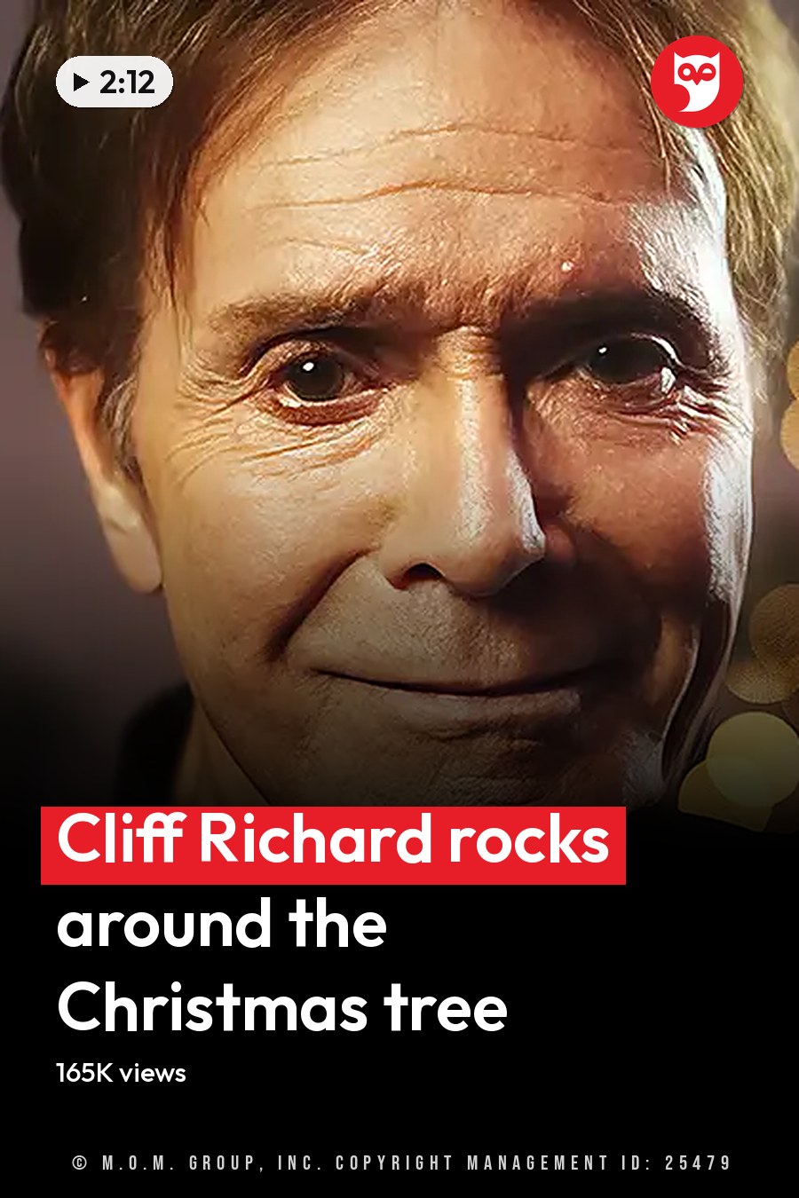 An older adult male wearing a dark, textured jacket or sweater with zippers, set against festive bokeh lights suggesting Christmas time. The headline runs in white letters across the lower third.