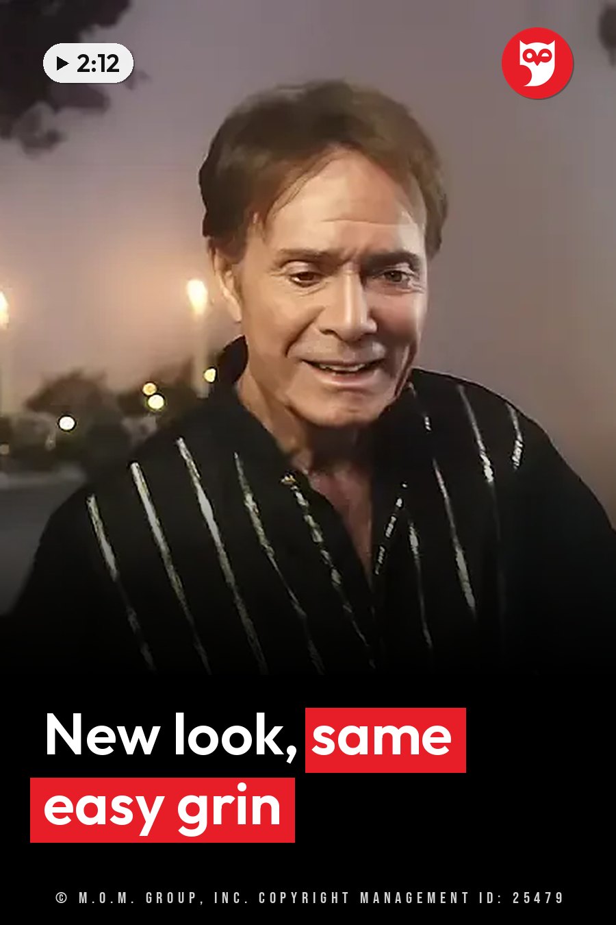 Cliff Richard, with short brown hair, smiles in a black shirt with silver vertical stripes. A headline runs in white letters across the lower third.