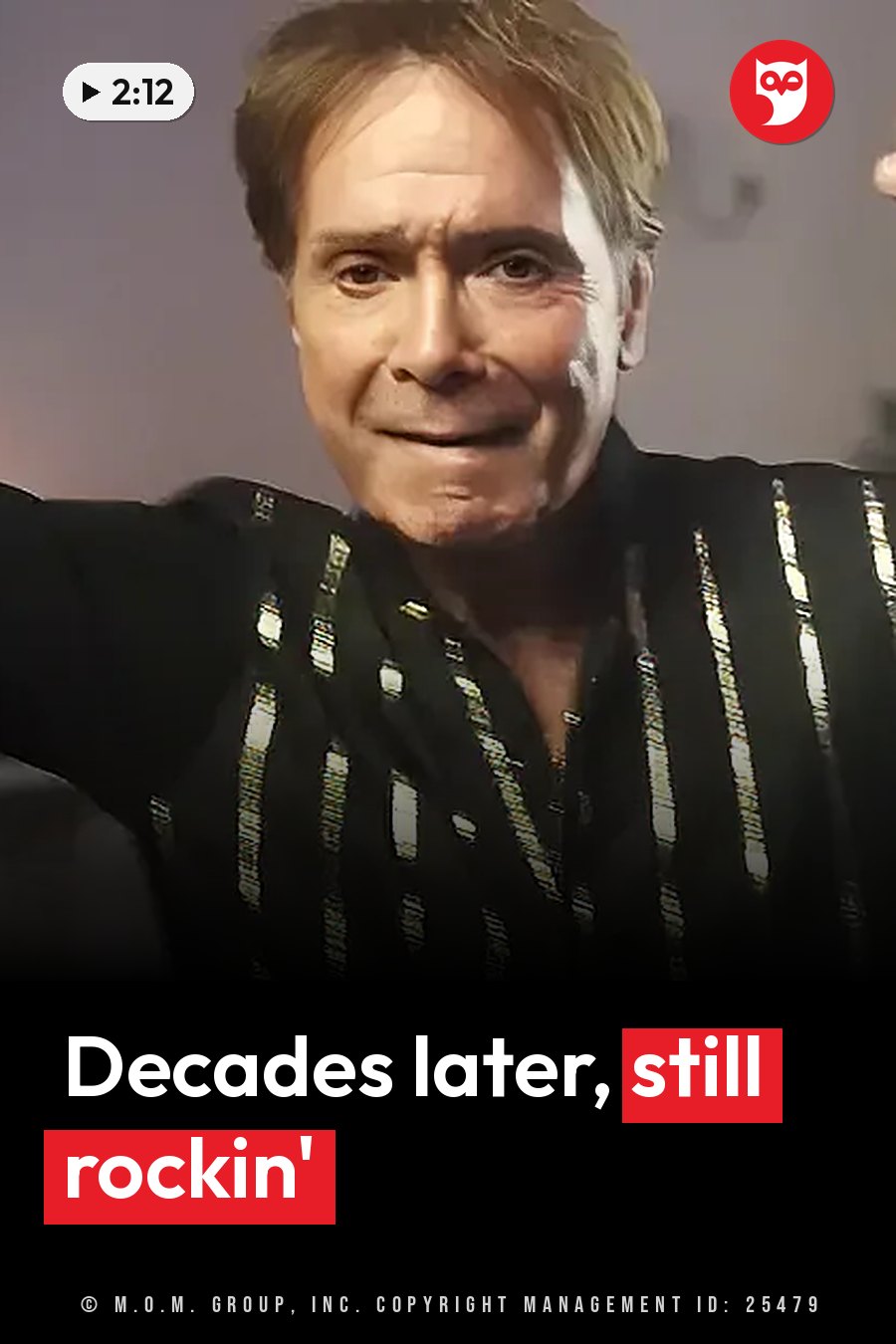 Cliff Richard, with light hair, wears a black shirt with gold stripes and smiles slightly while looking forward. A headline runs in white letters across the lower third.