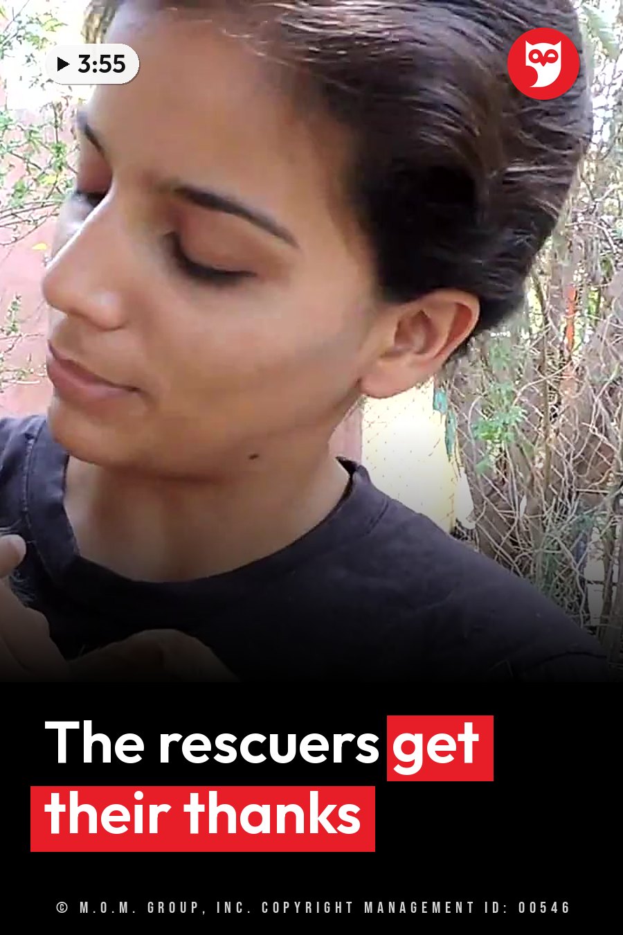 A person with dark hair tied back and eyes closed, in a black shirt, outdoors near green plants. A headline runs in white letters across the lower third.