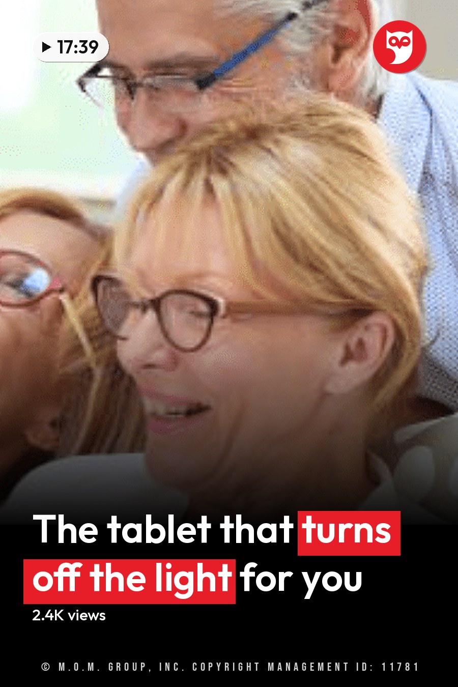 Three older adults in an indoor setting, possibly a living room with patterned cushions on what seems like a sofa, interacting with each other under natural light. The headline runs in white letters across the lower third.