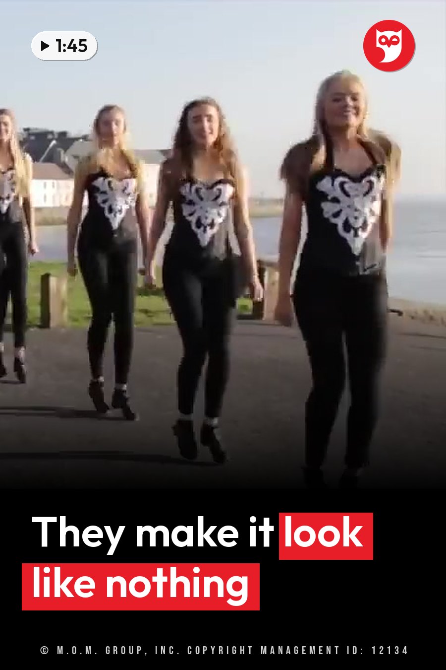 Four young women in matching black outfits walk toward the camera along a seaside path. A headline runs in white letters across the lower third.