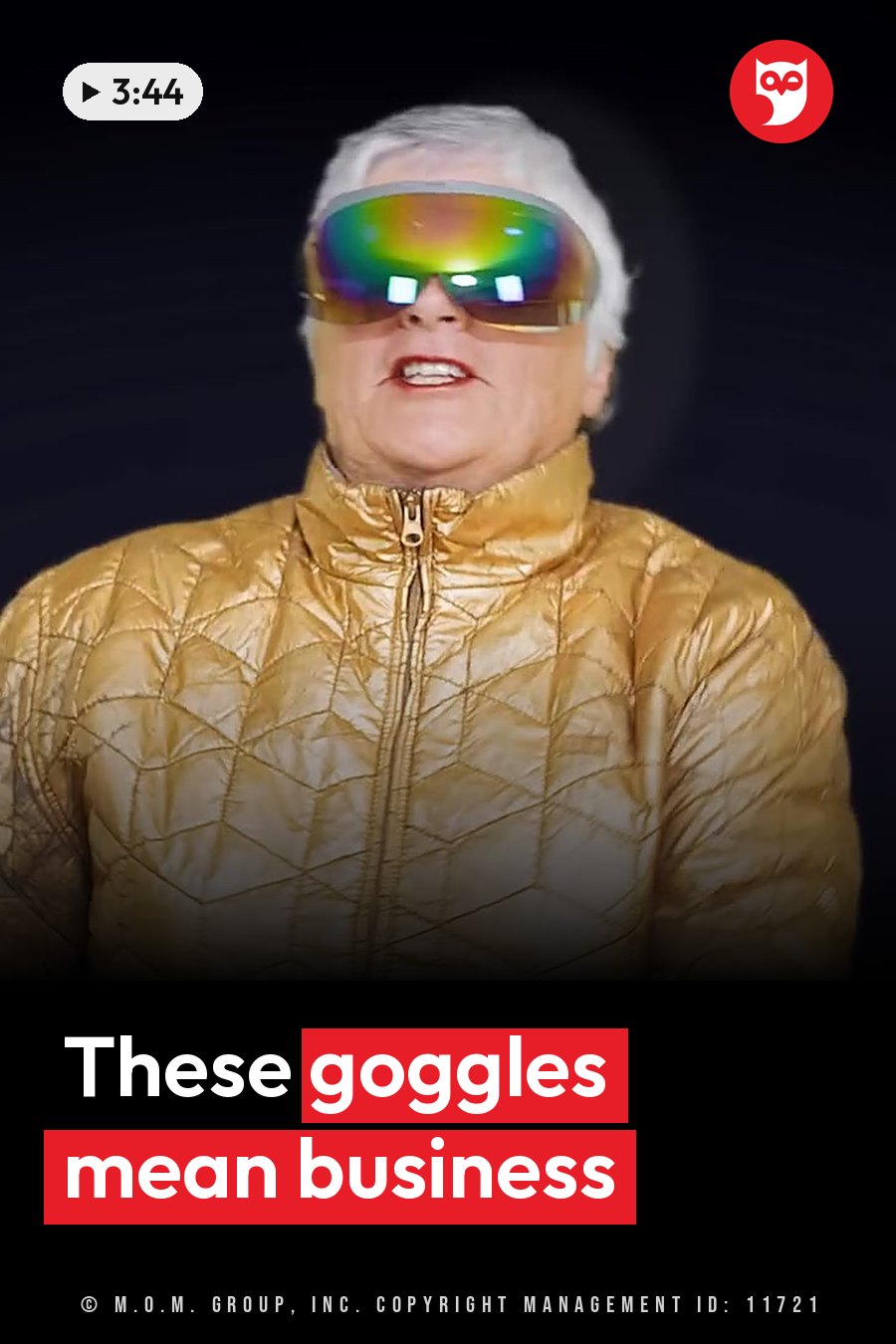 A person with white hair wears a gold quilted jacket and large reflective goggles against a dark background. A headline runs in white letters across the lower third.
