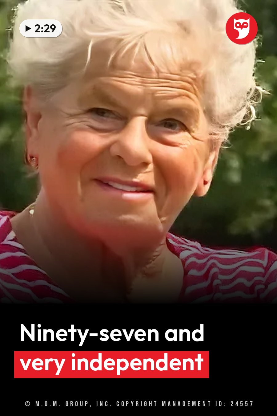 Marie Erickson, an elderly woman with white hair, smiles outdoors in a red and white striped shirt. A headline runs in white letters across the lower third.