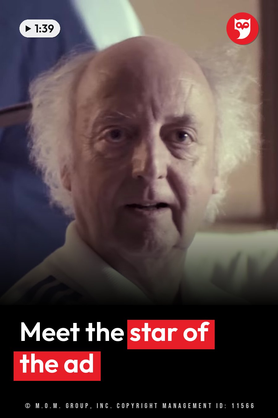 An older man with white hair, wearing a white shirt, looks forward while speaking. A headline runs in white letters across the lower third.