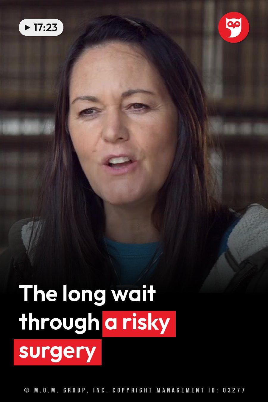 A woman with dark hair speaks, wearing a blue shirt under a jacket with a white fleece lining. A headline runs in white letters across the lower third.