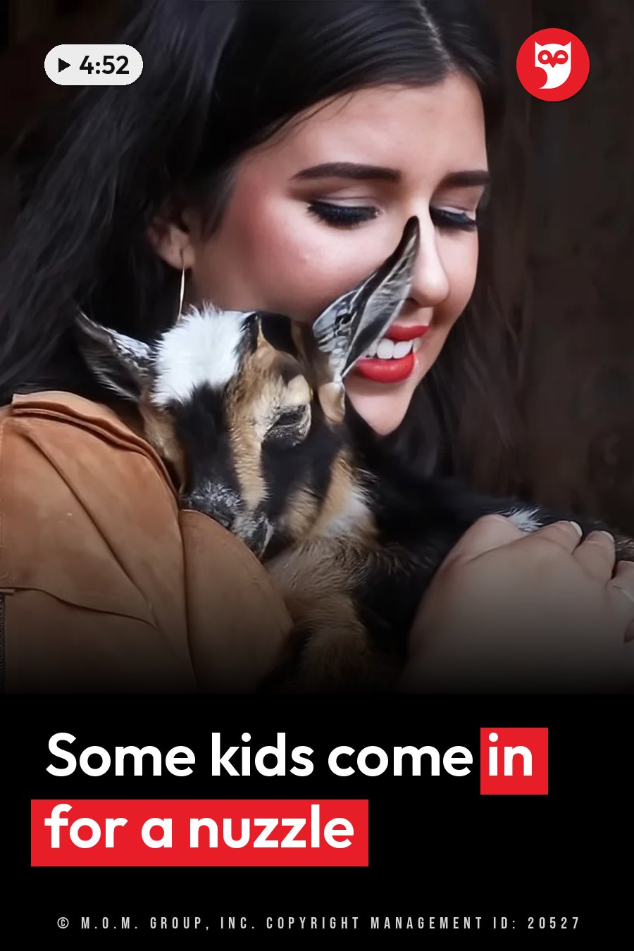 A woman with dark hair holds a small goat kid close to her face as the kid nuzzles her cheek. A headline runs in white letters across the lower third.