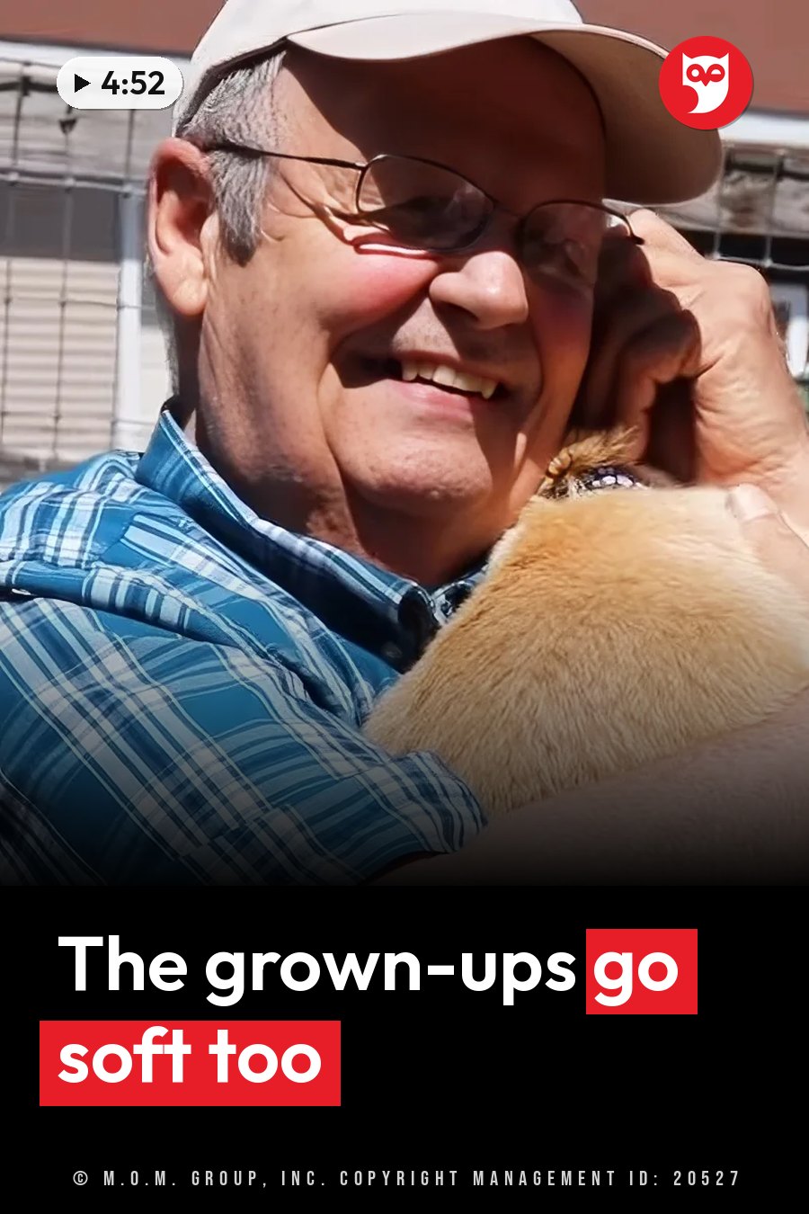 A man in a cap and glasses smiles while holding a small animal close to his chest. A headline runs in white letters across the lower third.