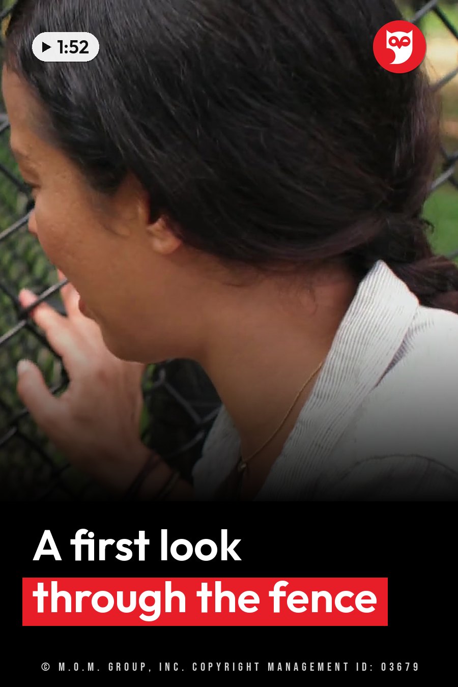A person with dark hair tied back leans against a chain-link fence with one hand resting on it. A headline runs in white letters across the lower third.