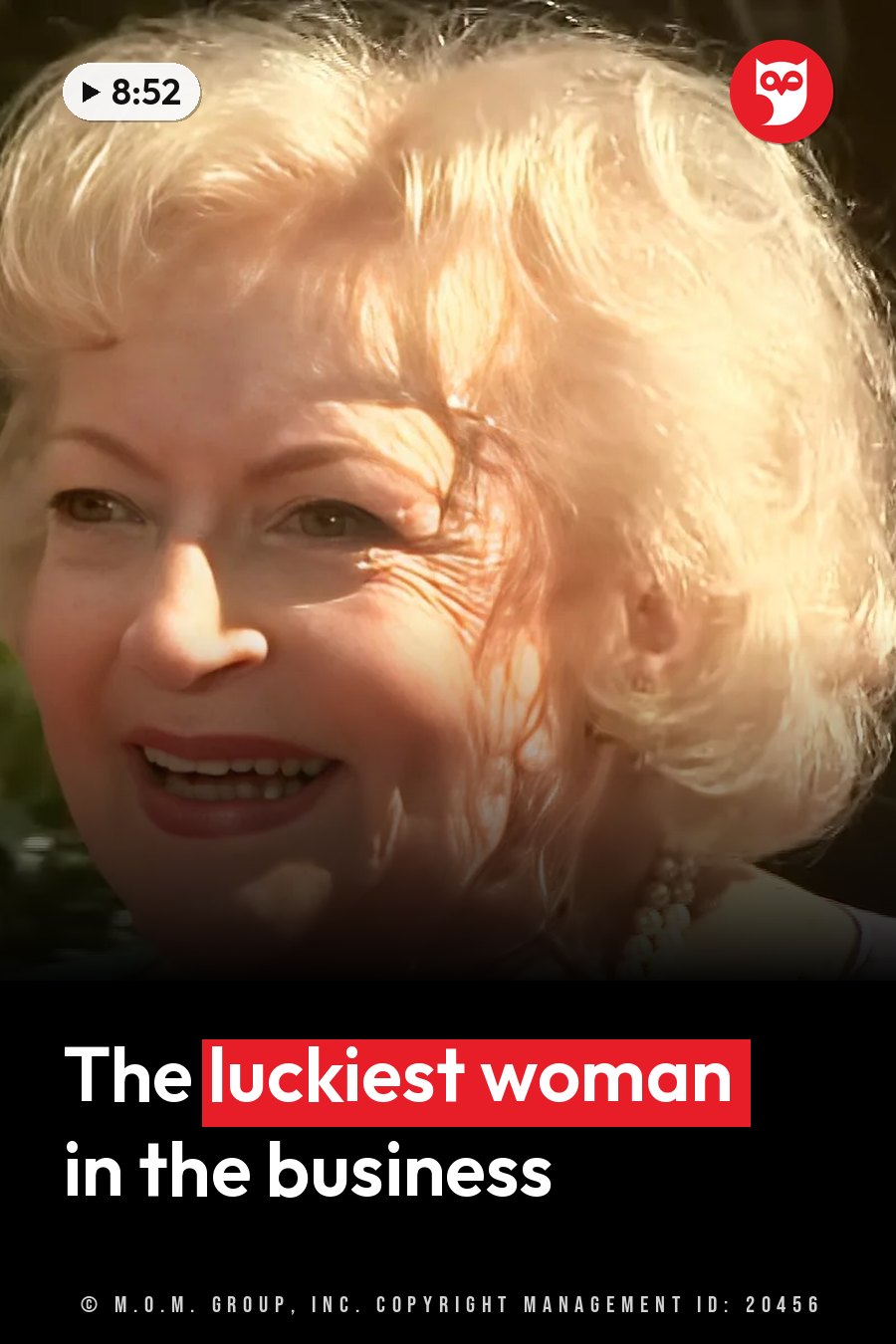 Betty White smiles, with blonde hair, pearl earrings and a necklace. A headline runs in white letters across the lower third.