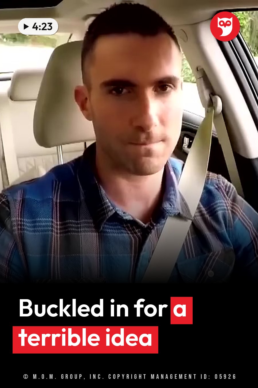A man in a plaid shirt sits buckled into a car seat, looking straight ahead. A headline runs in white letters across the lower third.