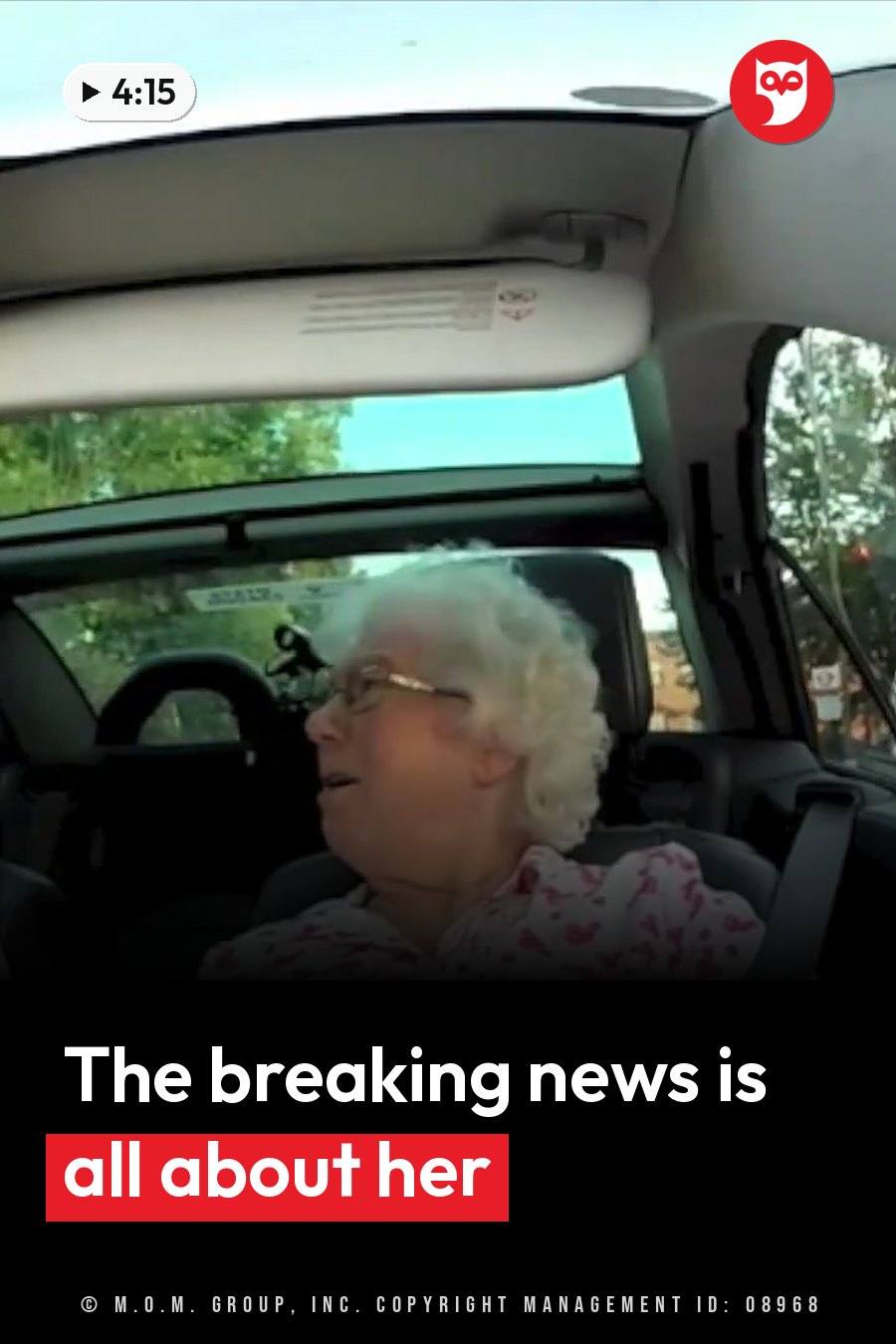 An older woman with curly white hair and glasses sits in a car, looking ahead, in a patterned shirt. A headline runs in white letters across the lower third.