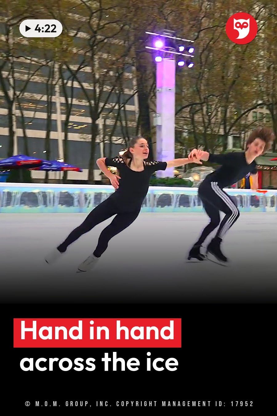 Two ice skaters hold hands as they glide across a rink. A headline runs in white letters across the lower third.