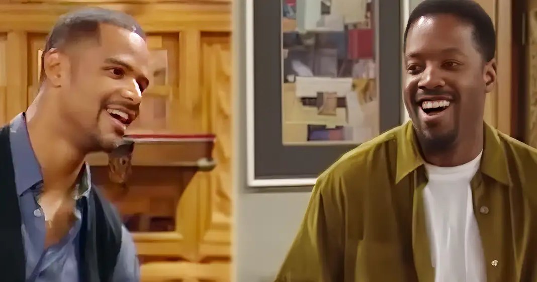 Two young adult males in casual indoor attire, one wearing a dark blue button-up shirt and the other in a mustard yellow button-down over white, surrounded by neutral-toned furniture and abstract artwork.