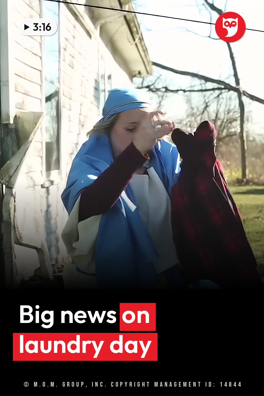 A person in blue clothes holds a red plaid item while standing outside near a house. A headline runs in white letters across the lower third.