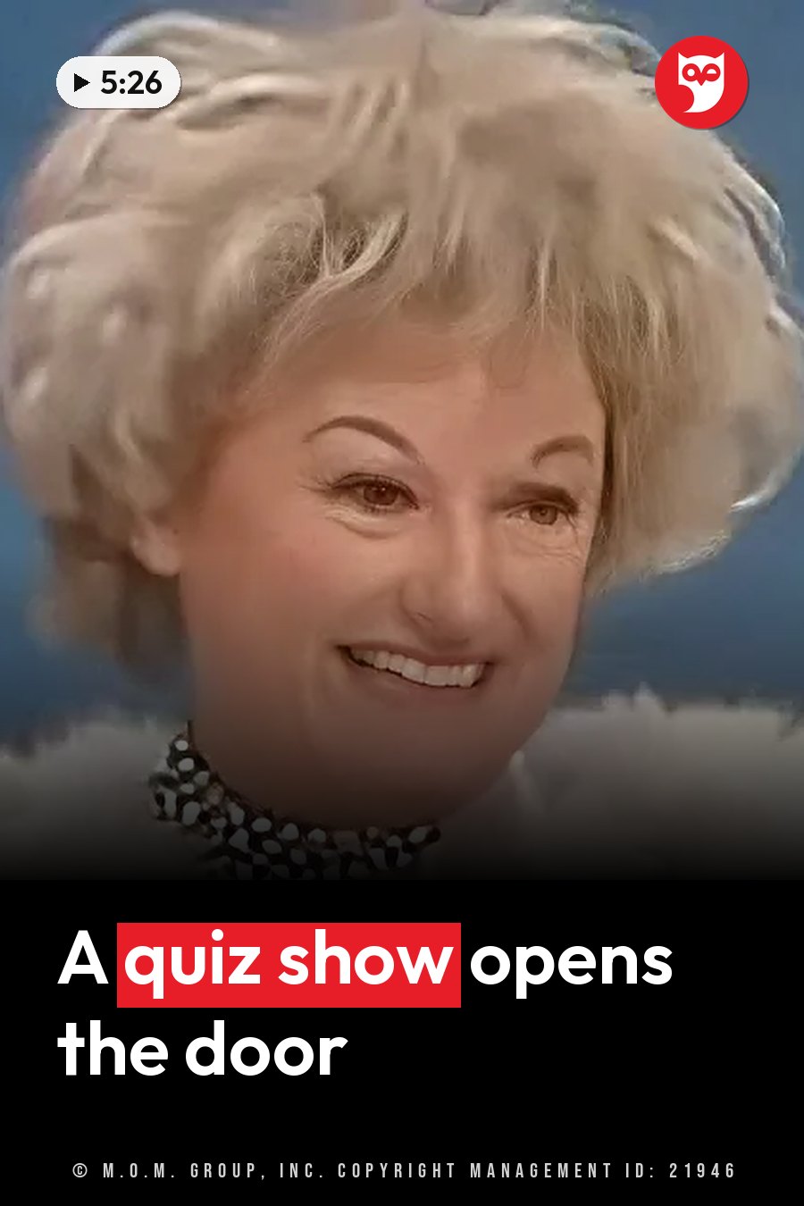 A smiling woman with short, light-colored hair and a sparkling necklace poses against a blue background. A headline runs in white letters across the lower third.