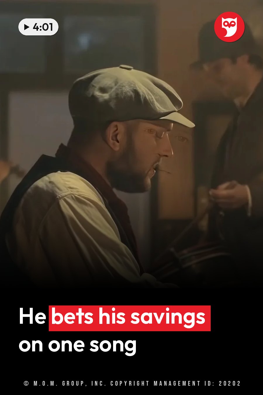 A man in a cap and vest plays an instrument while another person stands nearby holding something. A headline runs in white letters across the lower third.