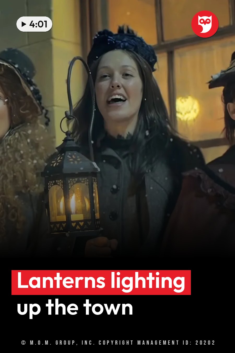 A woman holds a lit lantern outdoors near other people while snow falls. A headline runs in white letters across the lower third.