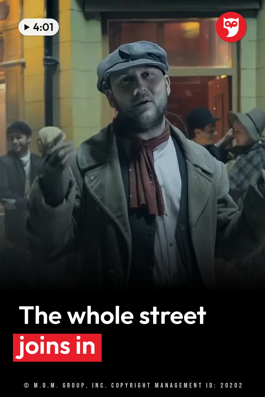 A man in a cap and coat stands outdoors, gesturing with his hands, while other people stand nearby on the street. A headline runs in white letters across the lower third.