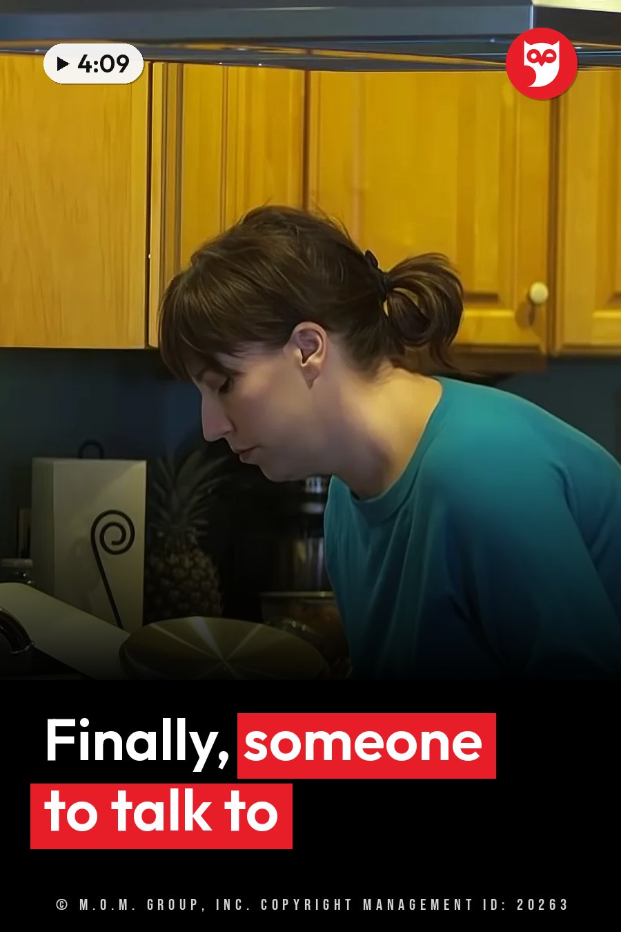 A woman with dark hair tied back, wearing a blue shirt, leans over a kitchen counter. A headline runs in white letters across the lower third.