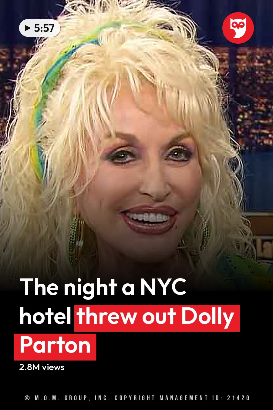 A middle-aged woman in a vibrant green and yellow patterned sequined dress on a late-night talk show set with urban night backdrop. The headline runs in white letters across the lower third.