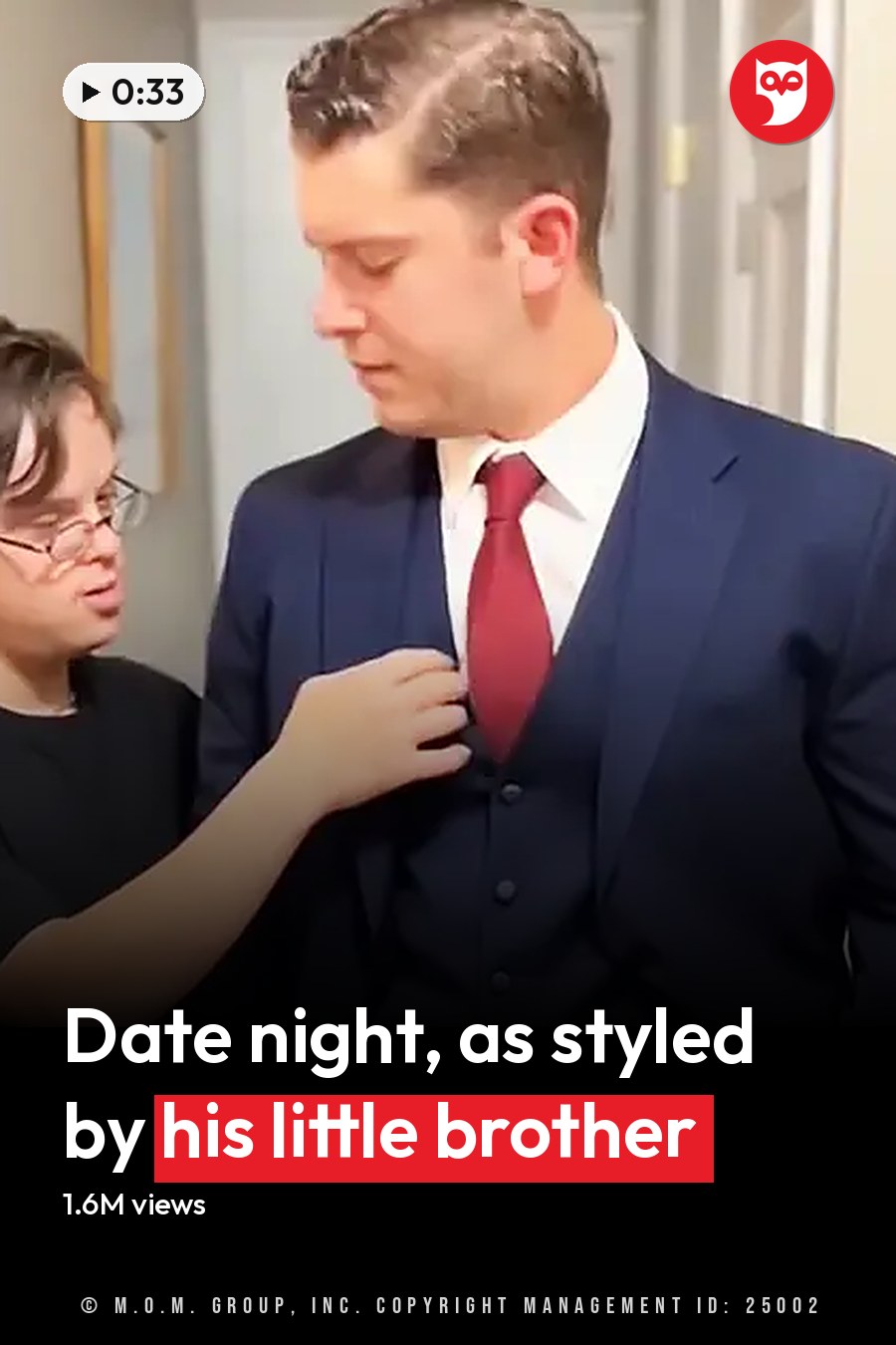 Two young adult males in a residential interior, wearing casual T-shirt and formal suit with red tie respectively. The headline runs in white letters across the lower third.