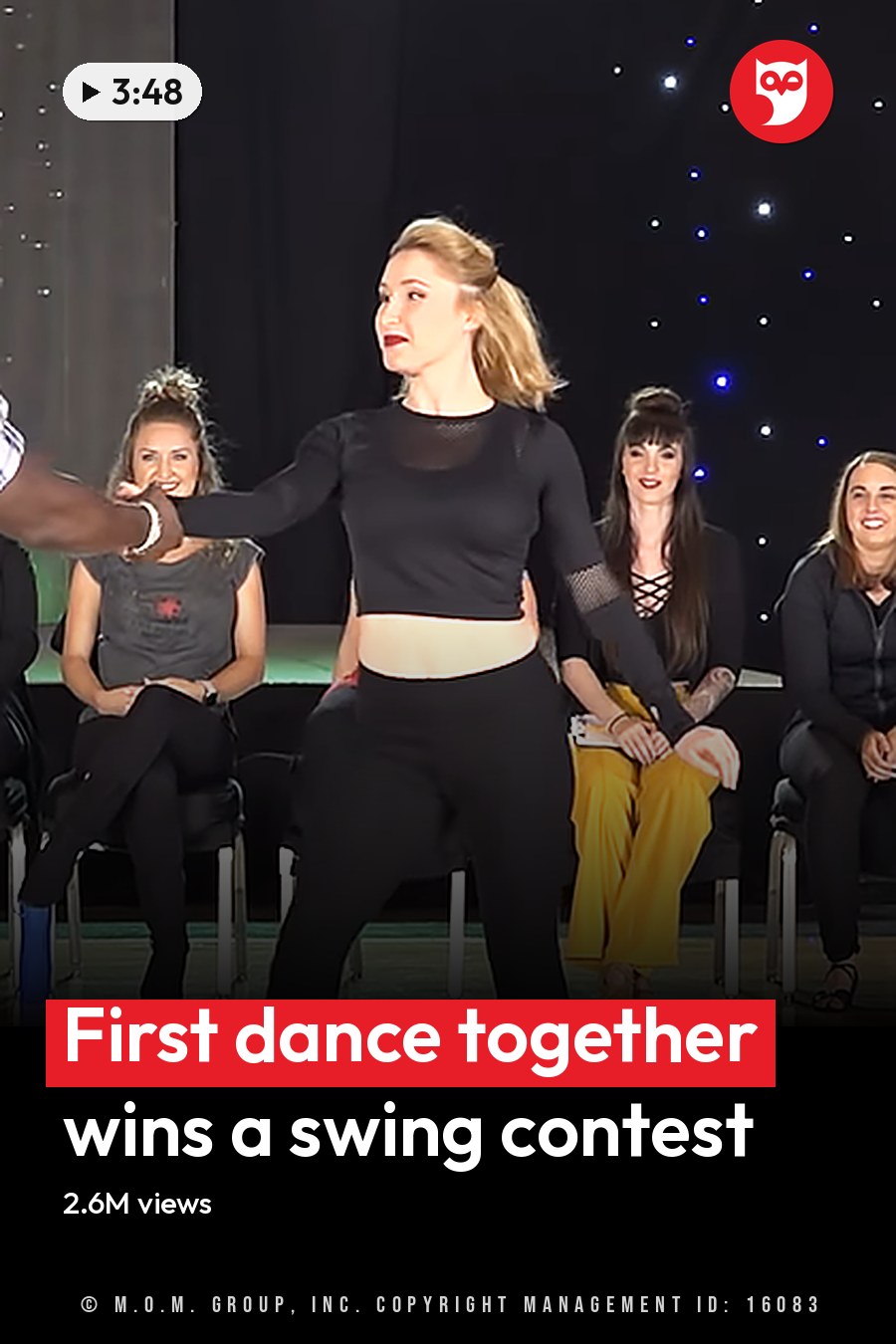 A dance performance at a studio or event space with participants in various settings and attire, including a man leading and a woman dancing. The headline runs in white letters across the lower third.