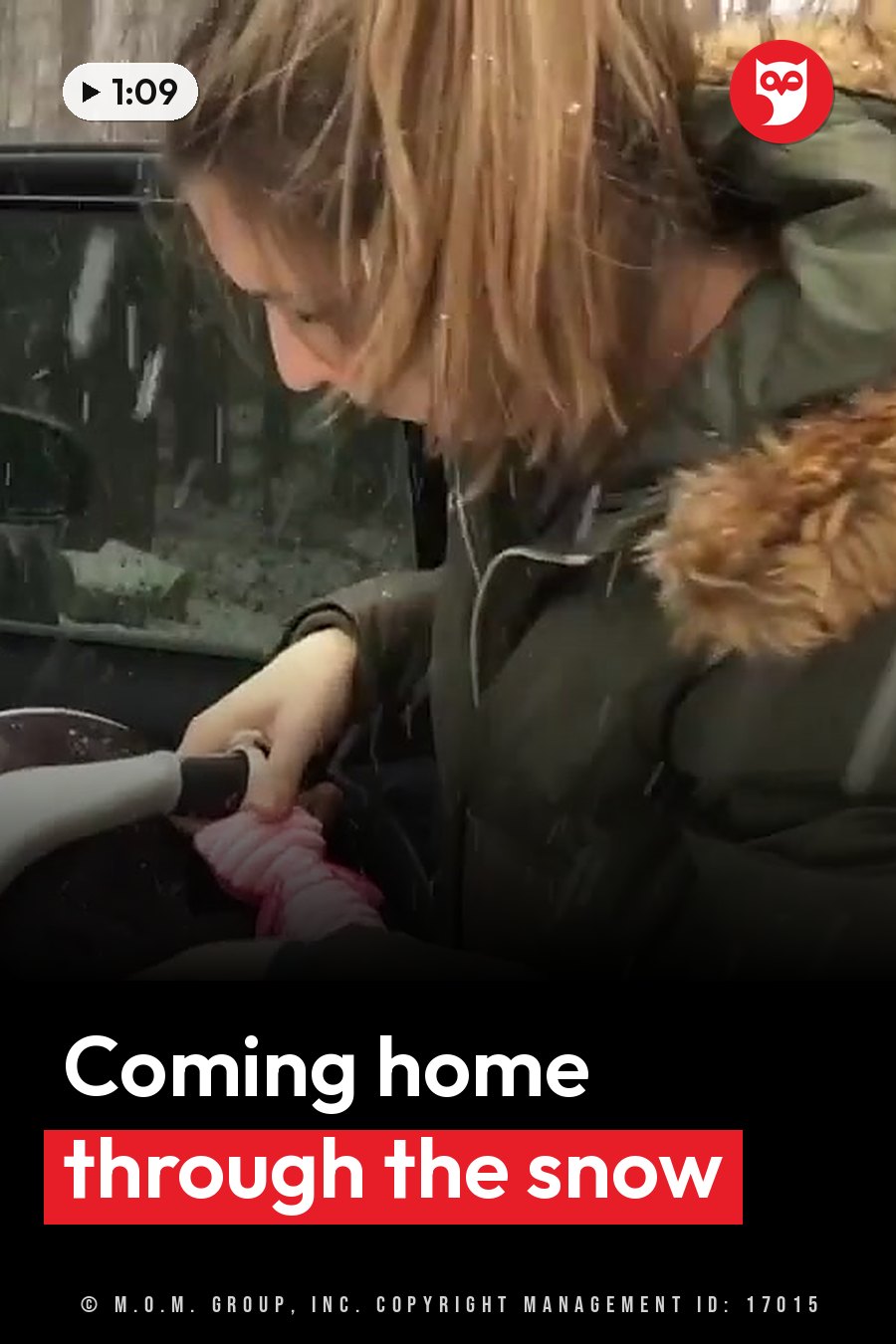 A person in a green coat with fur trim leans toward a car window as snow falls, holding something pink. A headline runs in white letters across the lower third.