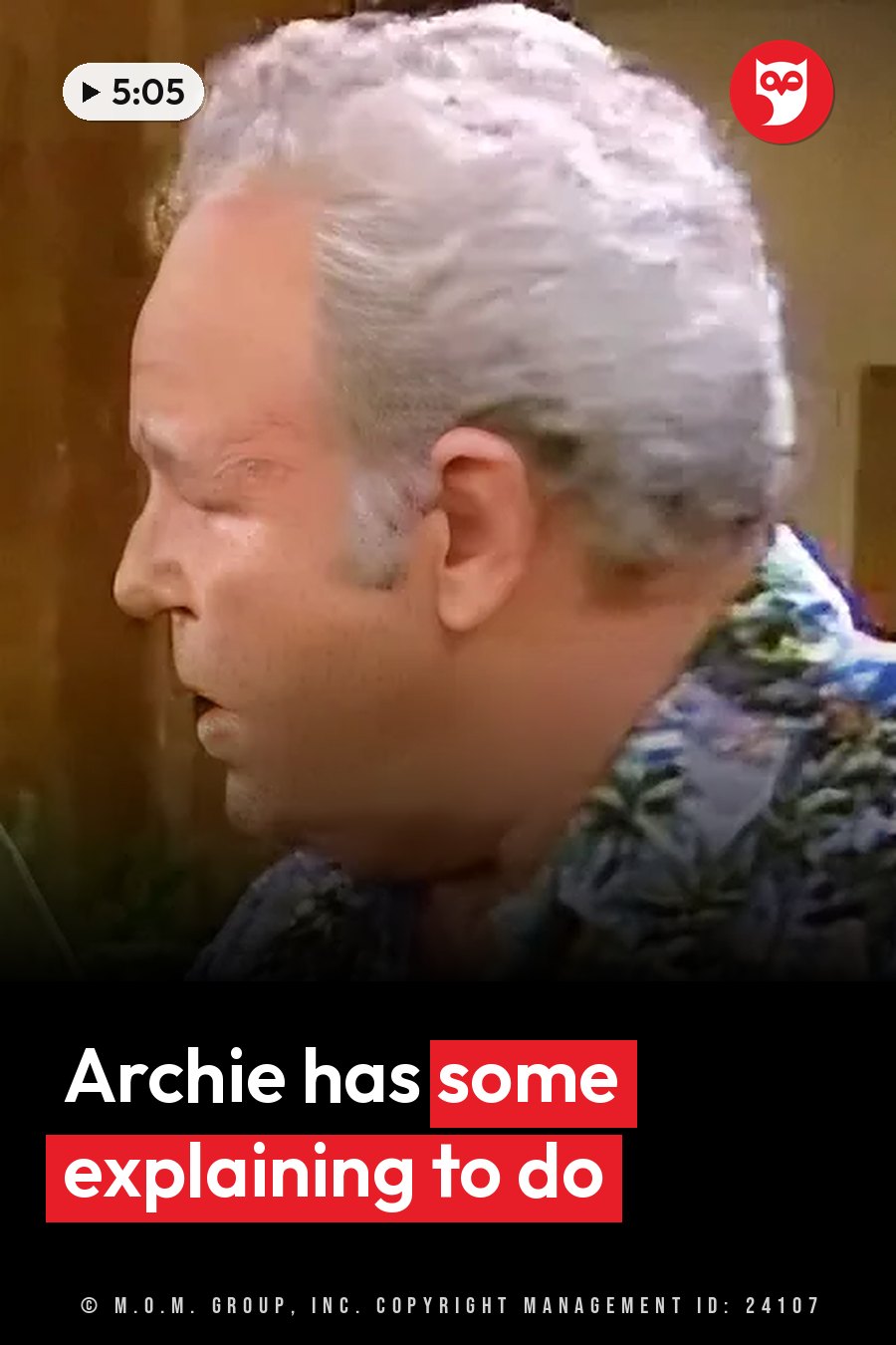 An older man with gray hair in a patterned shirt sits indoors and looks off to one side. A headline runs in white letters across the lower third.