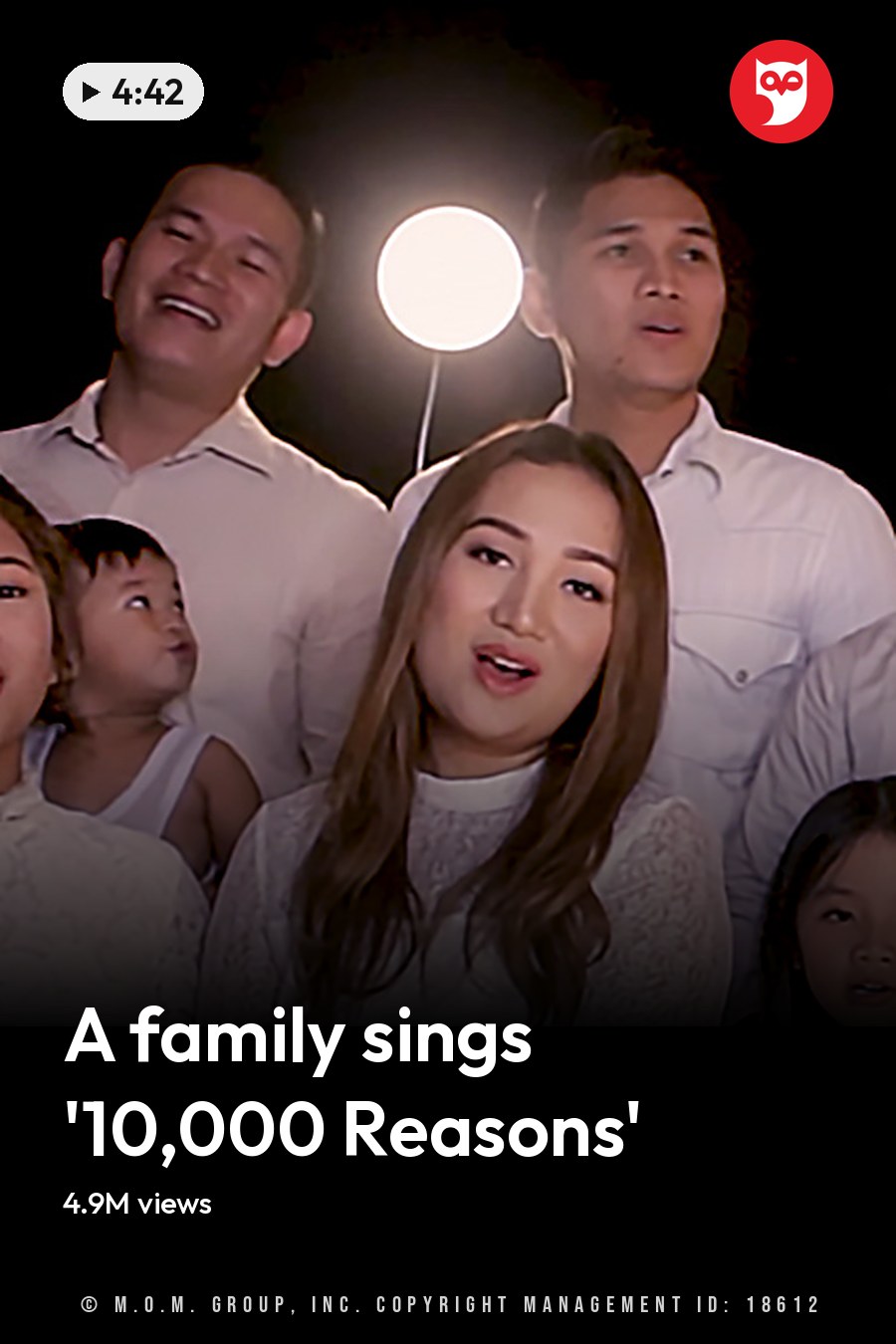 A family portrait in a studio setting with adults and children wearing white outfits, professional lighting and black background. The headline runs in white letters across the lower third.