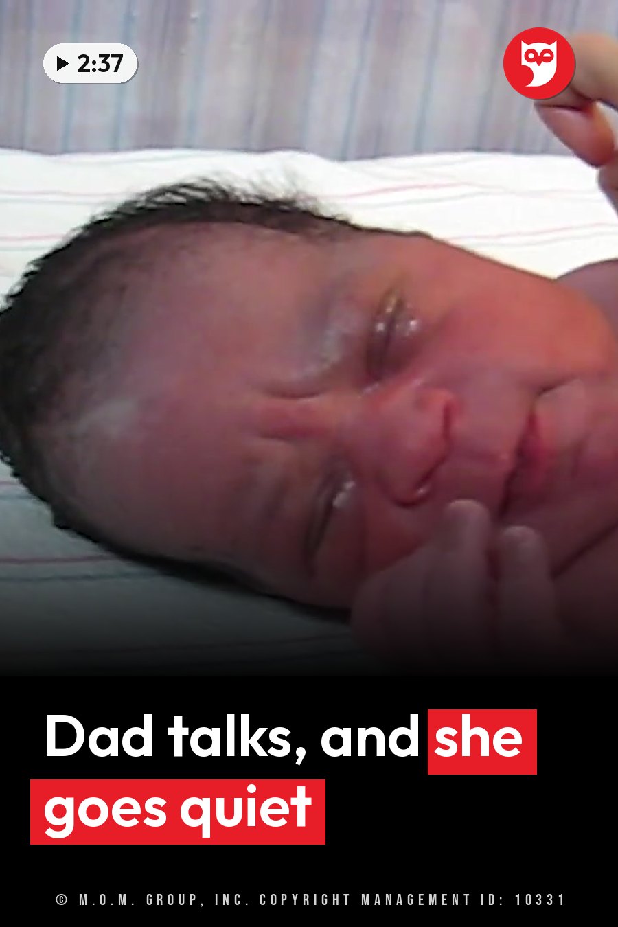 A newborn baby lies on her back with her eyes closed and one hand near her face. A headline runs in white letters across the lower third.