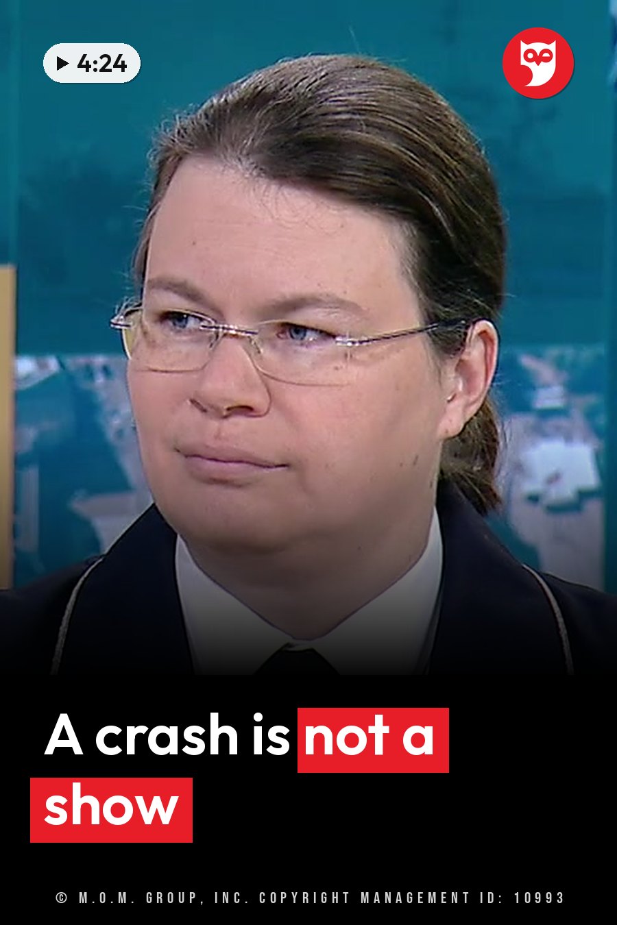 A person with glasses and pulled-back hair, in a dark jacket over a white shirt, looks slightly to one side. A headline runs in white letters across the lower third.