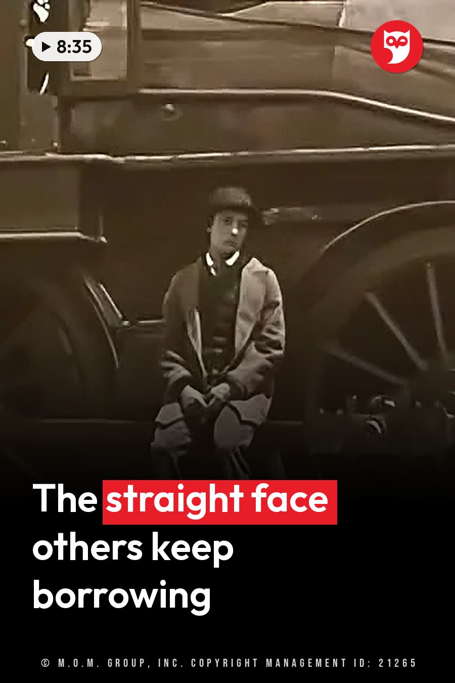 Buster Keaton in a coat and hat sits beside a large wheeled vehicle, looking straight ahead. A headline runs in white letters across the lower third.