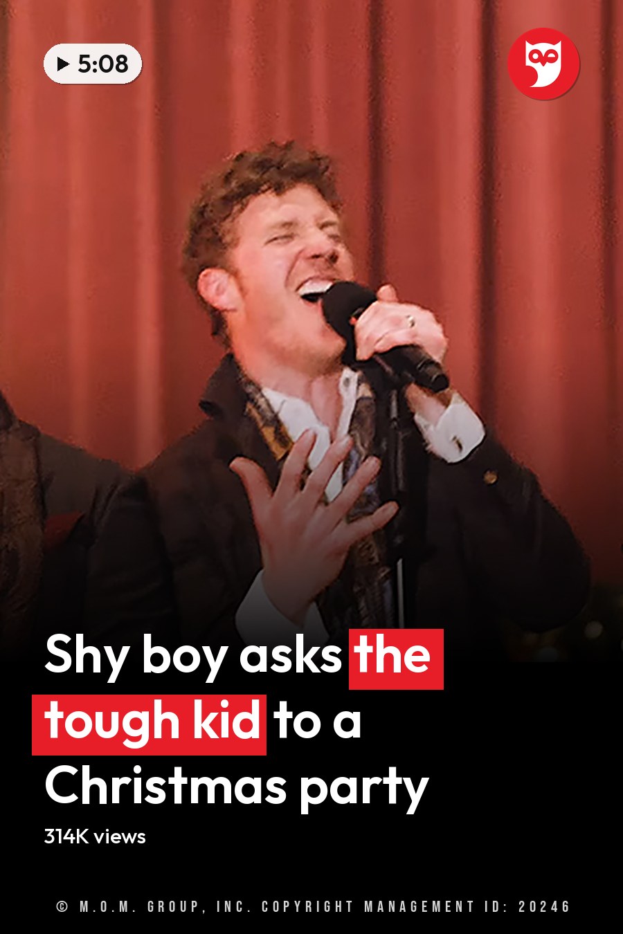 Group performance scene at an indoor event, possibly a concert or holiday celebration with formal attire and festive decor. The headline runs in white letters across the lower third.