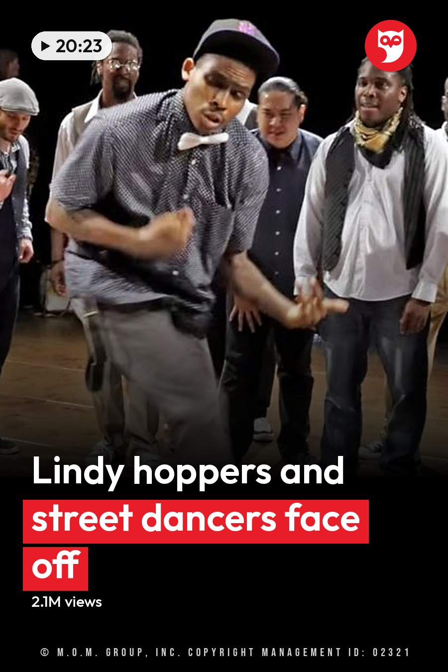 A young adult male dancer in an indoor dance studio or performance space, surrounded by various individuals engaged in different activities. The headline runs in white letters across the lower third.