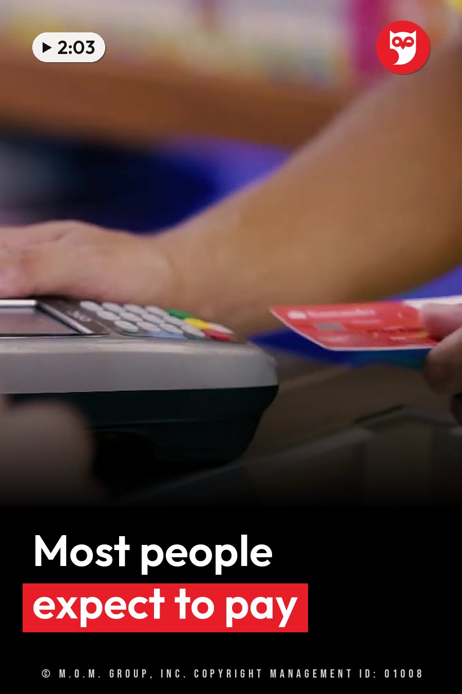 A person inserts a red card into a payment terminal. A headline runs in white letters across the lower third.