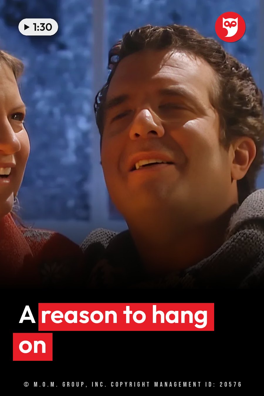 A man and a woman smile close together, the man looking slightly upward, the woman partly visible beside him. A headline runs in white letters across the lower third.