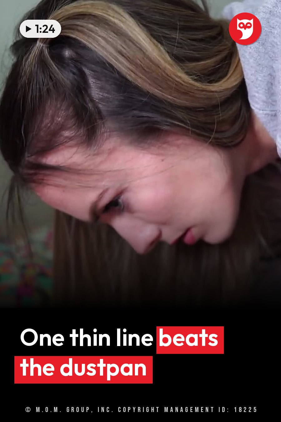 A woman with brown hair tied up tilts her head and looks down at something below her. A headline runs in white letters across the lower third.