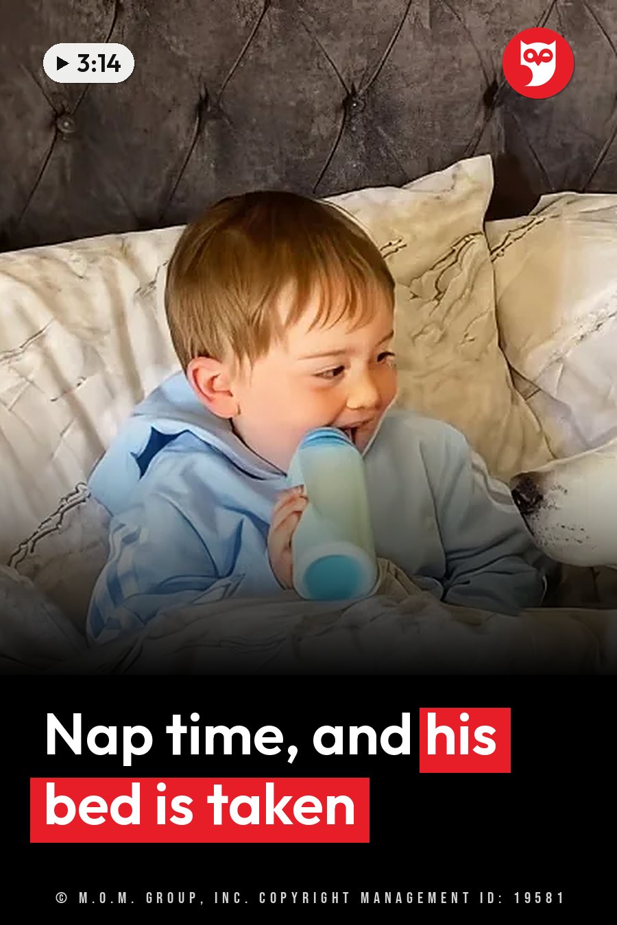 A young child sits on a bed holding a sippy cup and looks off to the side. A headline runs in white letters across the lower third.