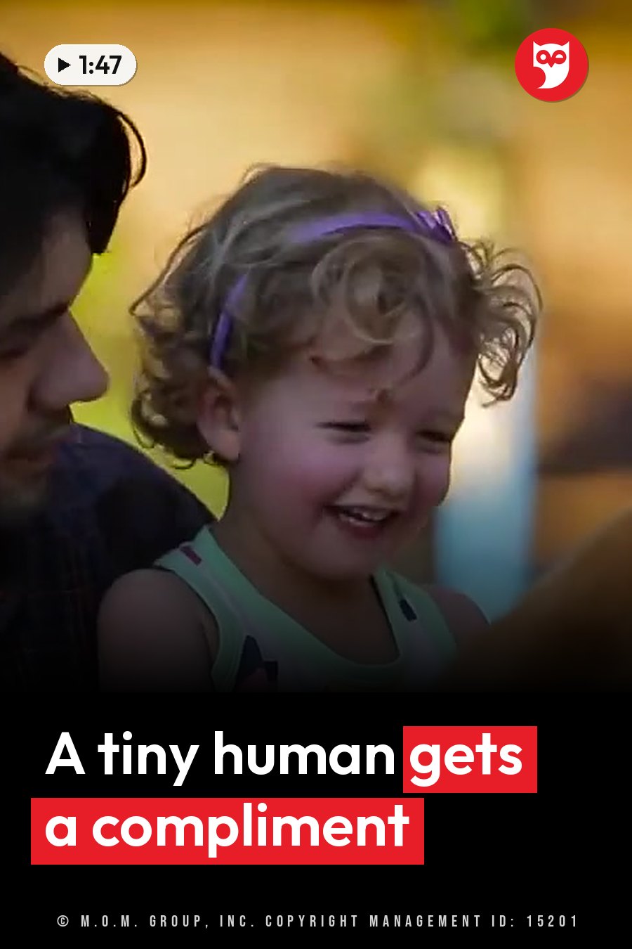 A young child with curly hair and a purple headband smiles while sitting beside an adult. A headline runs in white letters across the lower third.