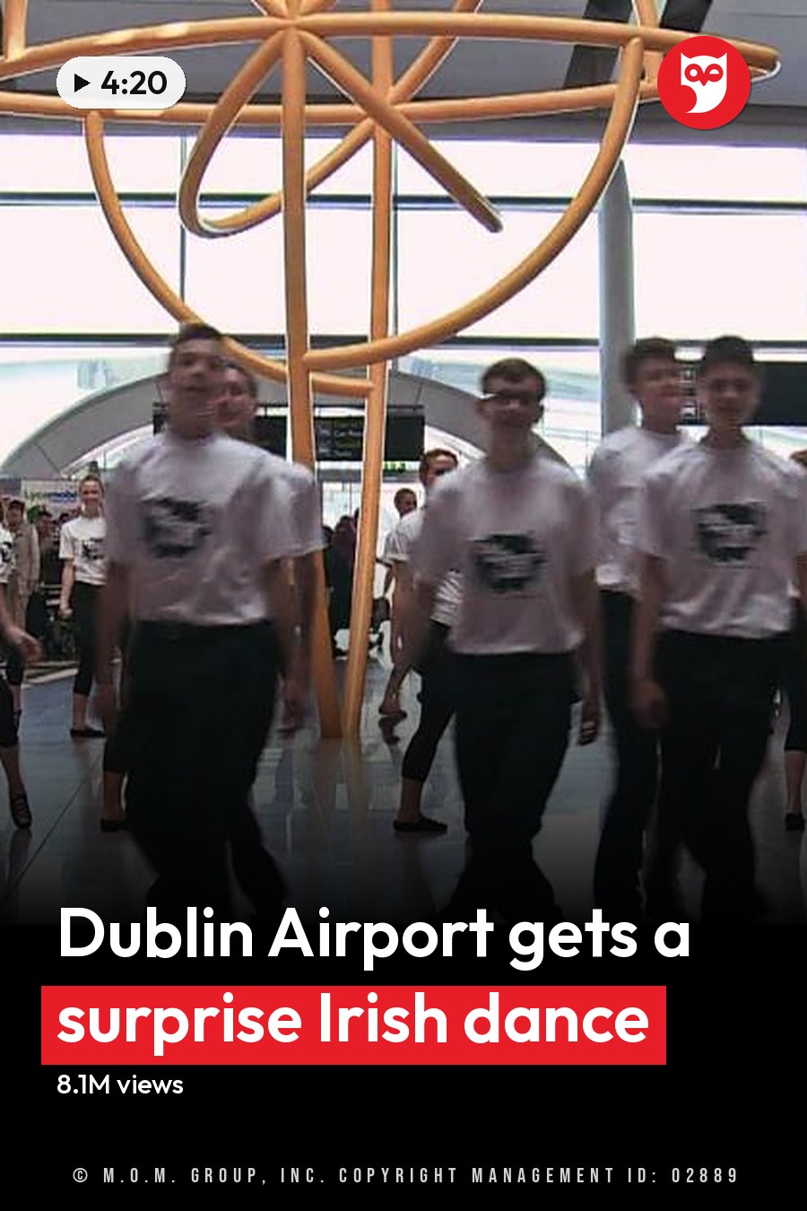Young adults performing synchronized dance steps in a modern airport terminal with golden sculpture and directional signs visible. The headline runs in white letters across the lower third.