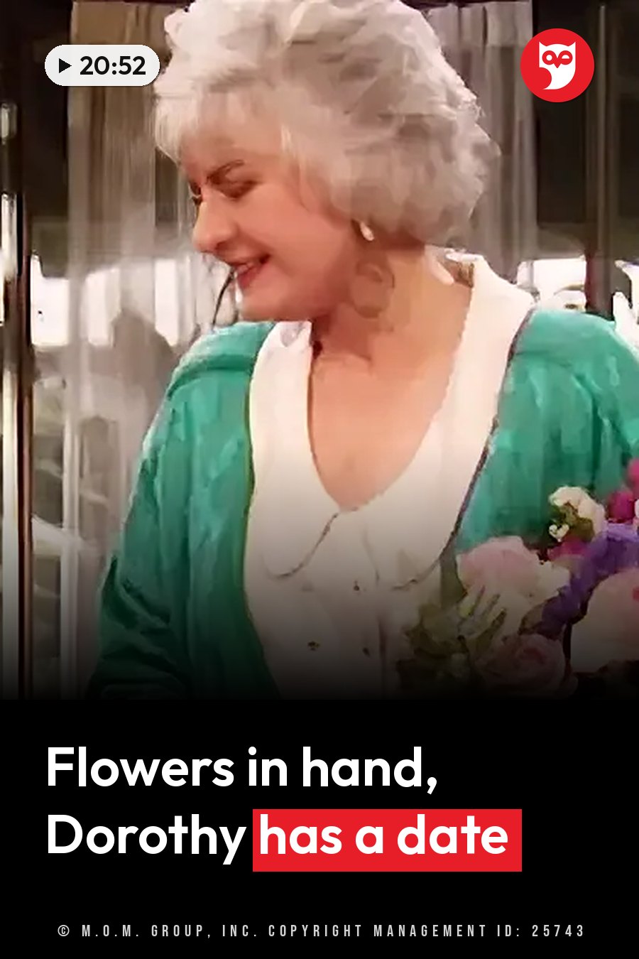 An older woman with white hair, dressed in green, smiles and holds a bouquet of flowers near her chest. A headline runs in white letters across the lower third.