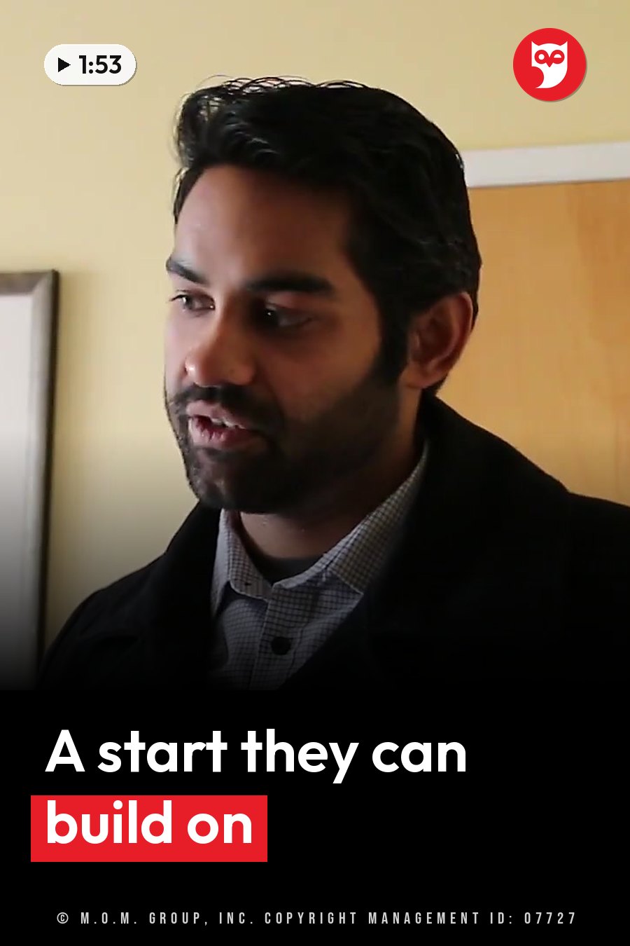 Akash Kalia, in a jacket over a shirt, looks down as he speaks. A headline runs in white letters across the lower third.