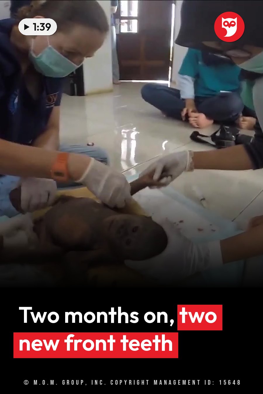 Carers in gloves and masks tend to a small orangutan lying on a surface indoors. A headline runs in white letters across the lower third.