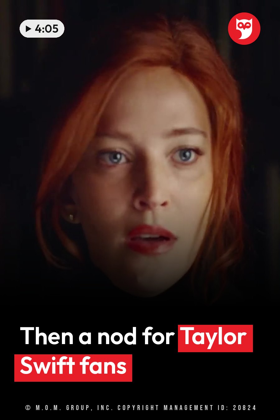 A woman with red hair and blue eyes looks ahead with her mouth slightly open, wearing a dark top and a small earring. A headline runs in white letters across the lower third.