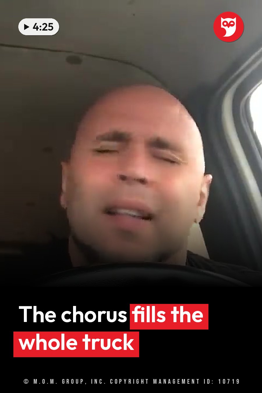 A bald man with his eyes closed sits inside a car, his mouth slightly open. A headline runs in white letters across the lower third.