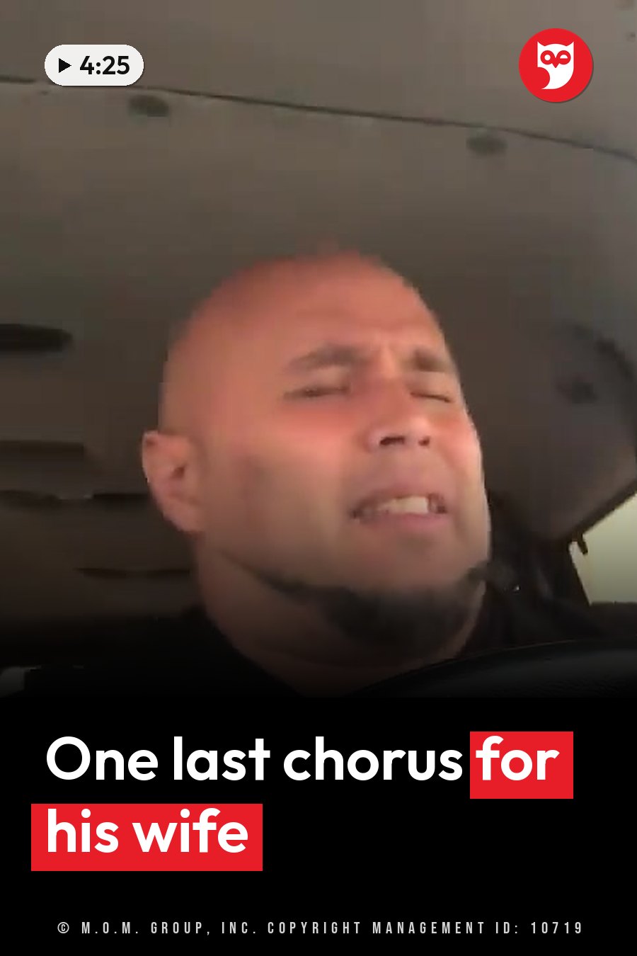 A bald man with a goatee sits inside a vehicle with his eyes closed and his mouth slightly open. A headline runs in white letters across the lower third.