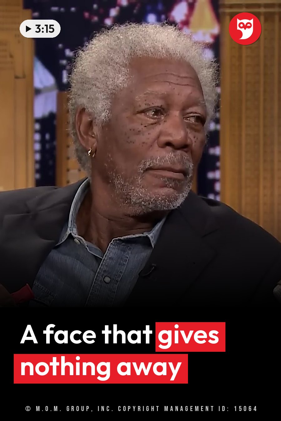 An older man with gray hair and a beard sits in a jacket over a denim shirt, looking off to the side. A headline runs in white letters across the lower third.